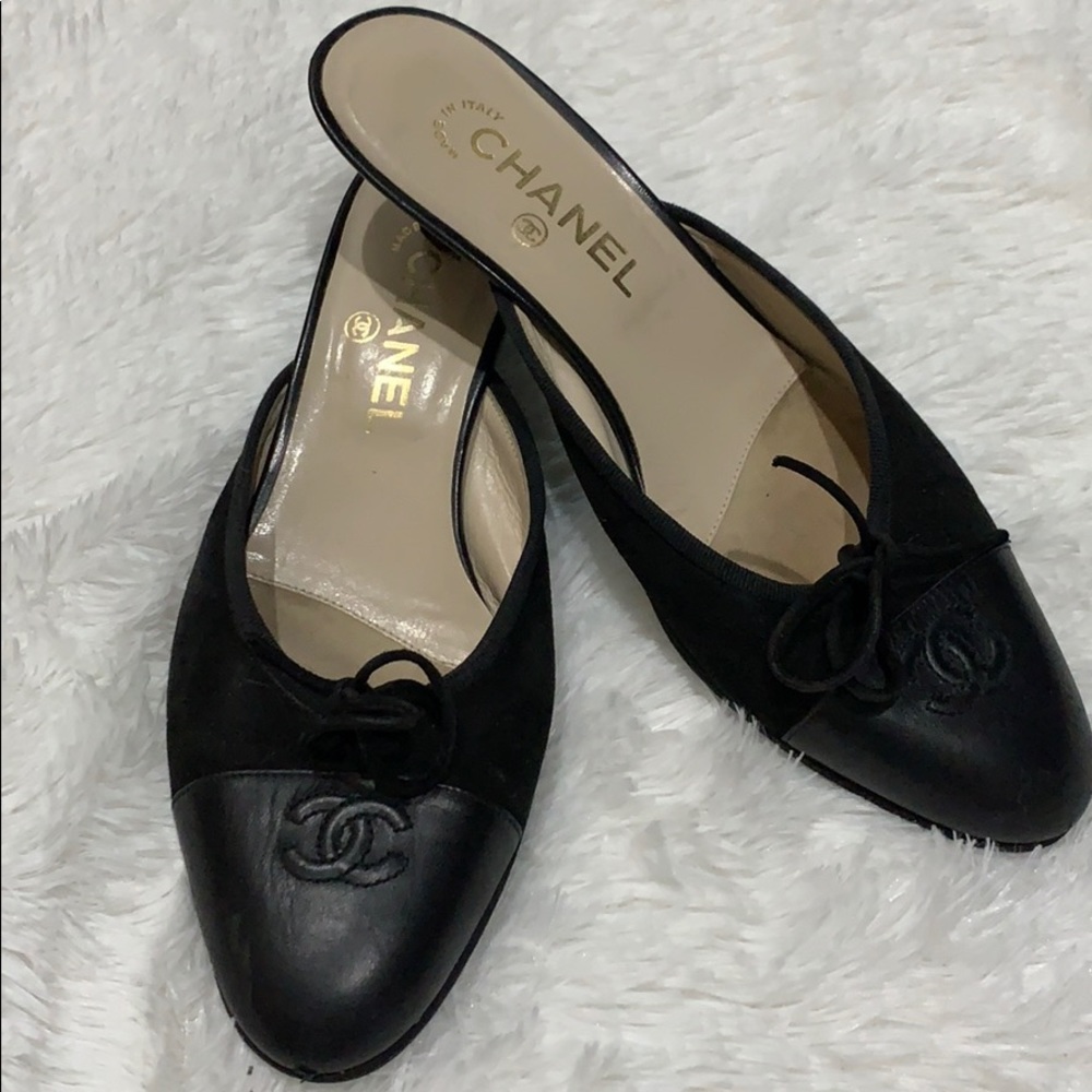 Black Chanel with kitten heel. Stitched logo